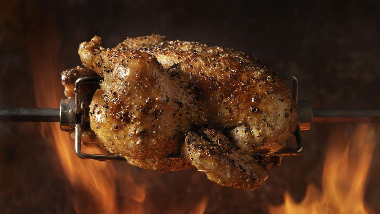 Peruvian rotisserie chicken prepared for the Taco Works menu expansion.